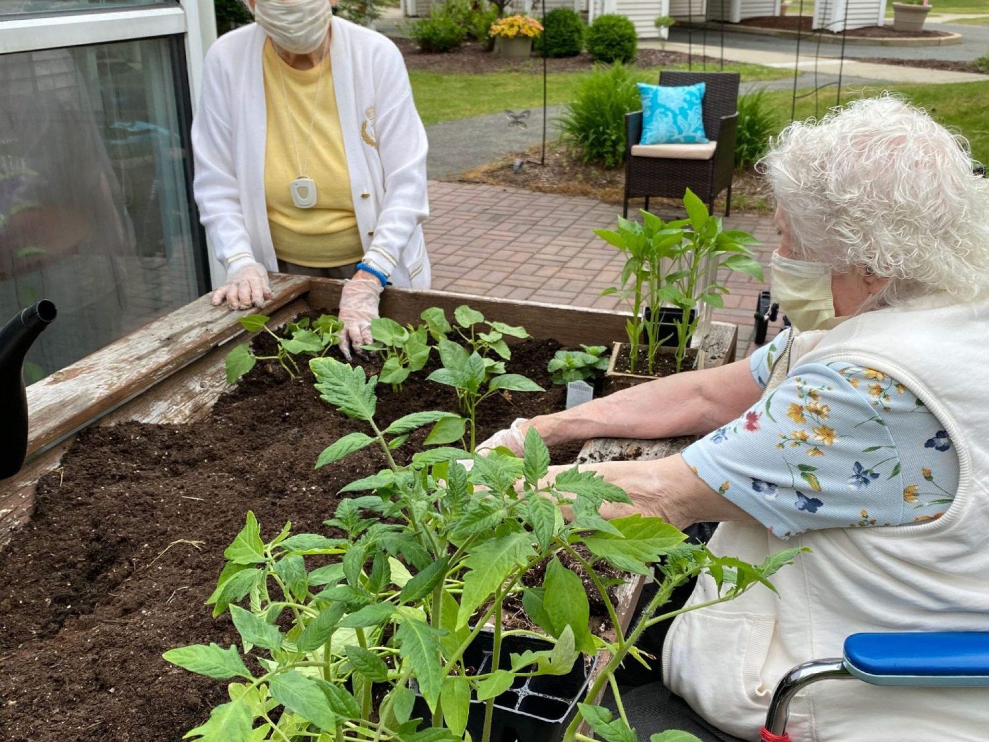 Ruth's House residents gardening in their masks