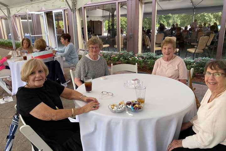 Women playing cards at the Frankel Kinsler Golf Tournament