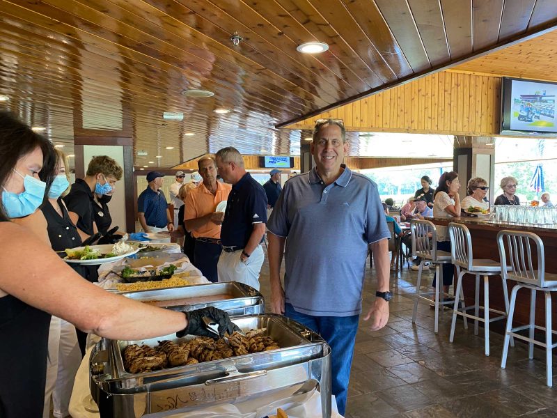 Guests enjoying a meal at the Frankel Kinsler Golf Tournament