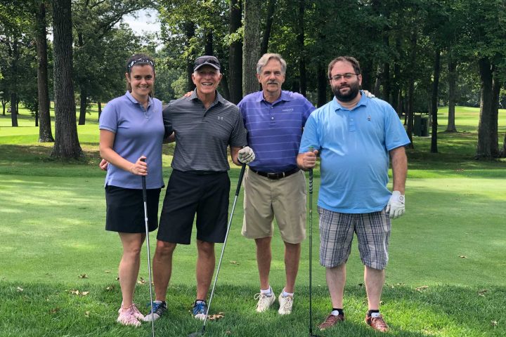 Four person team at the Frankel Kinsler Golf Tournament