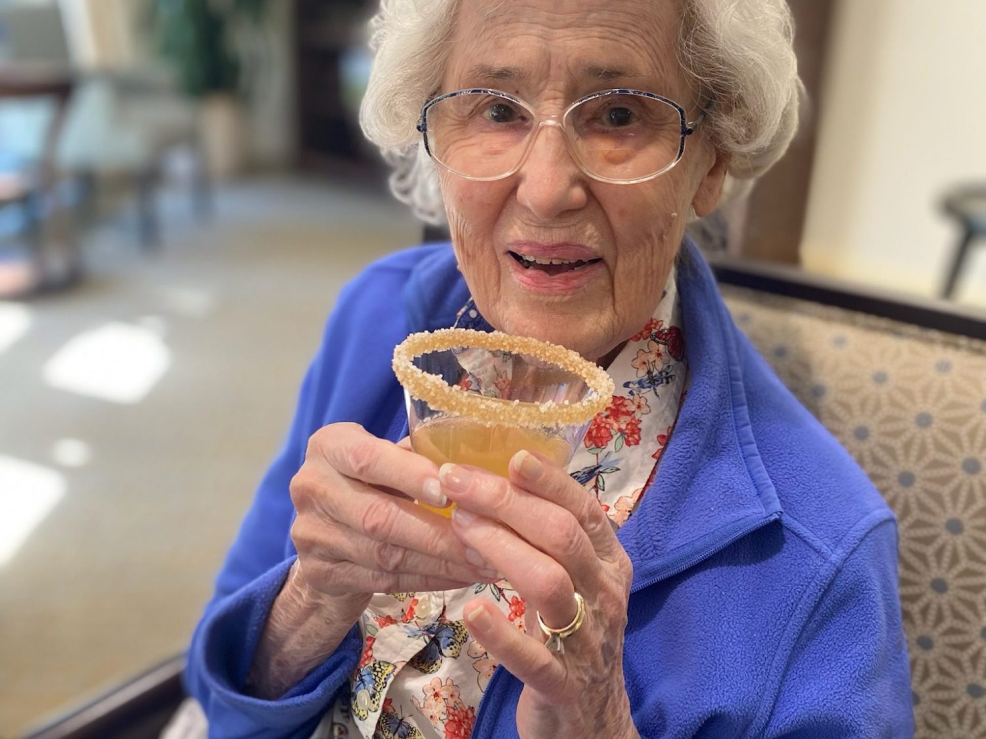 A resident with her holiday drink