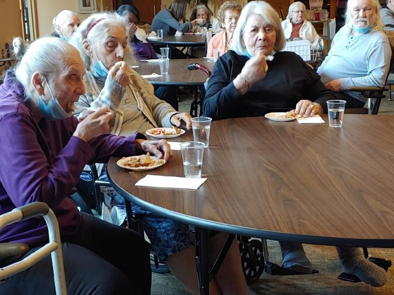 Residents eating and enjoying pies