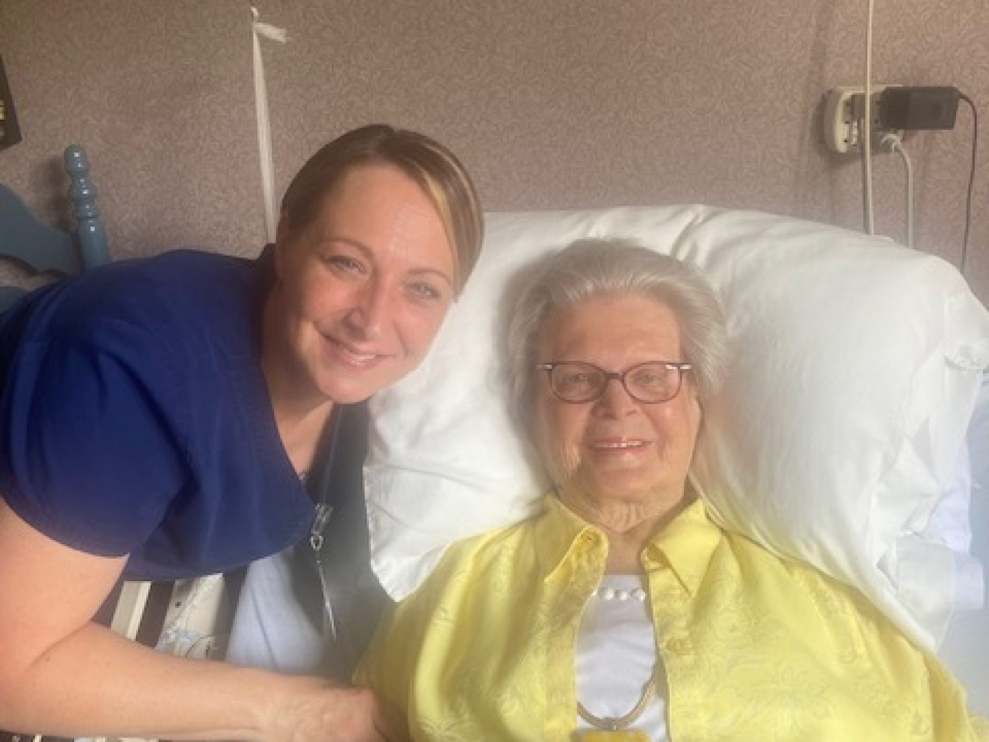 Jessica Brown, CNA and TNA Preceptor shares a moment with resident Jeanne McGrath