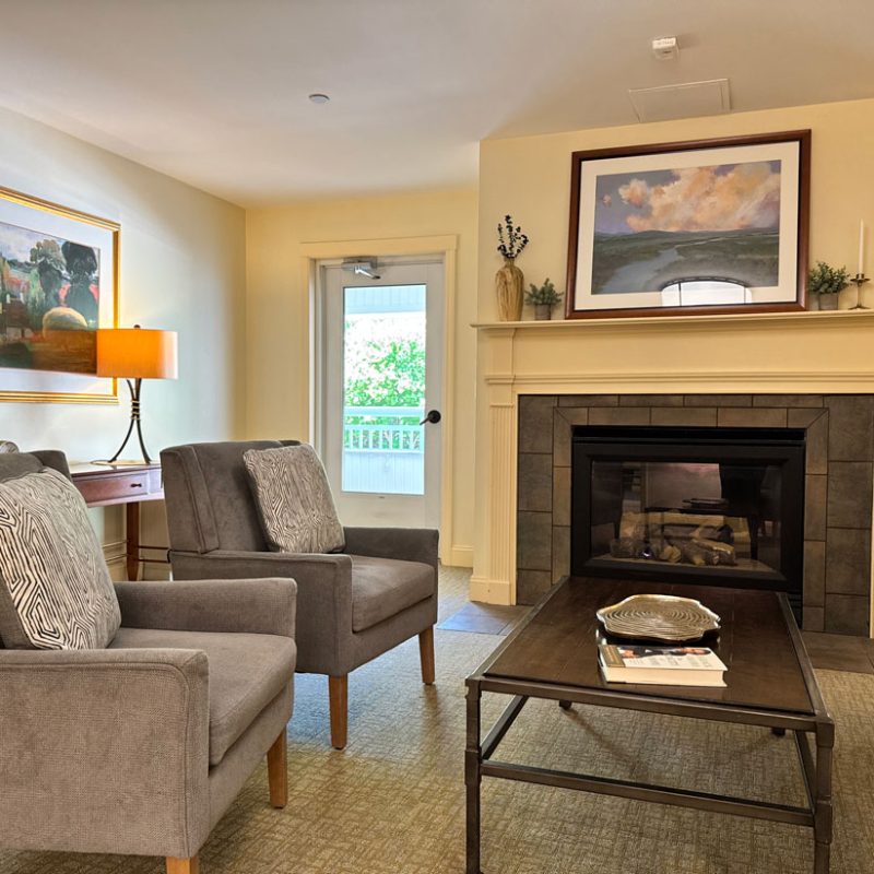 A living room with a fireplace.